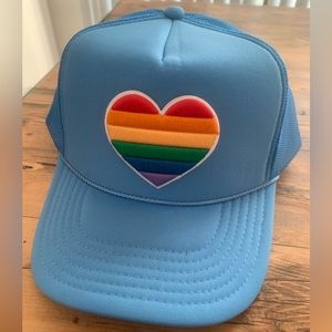 Blue trucker hat with rainbow heart